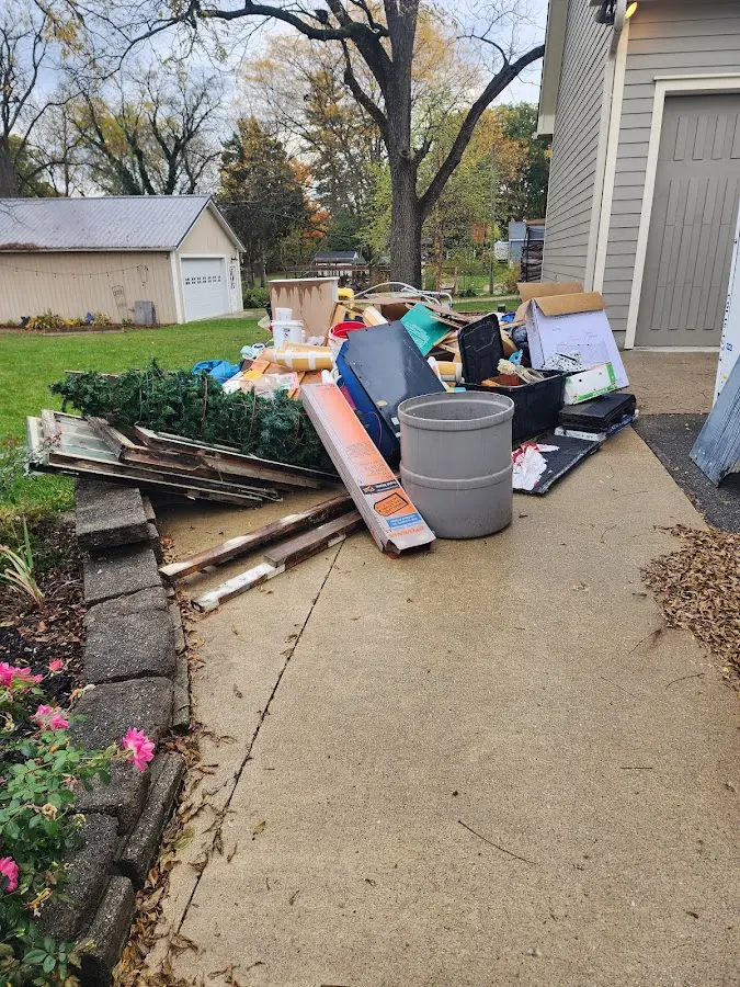 Dumpster being loaded with debris for 3 Yard Dumpster Rental in West Pleasant View